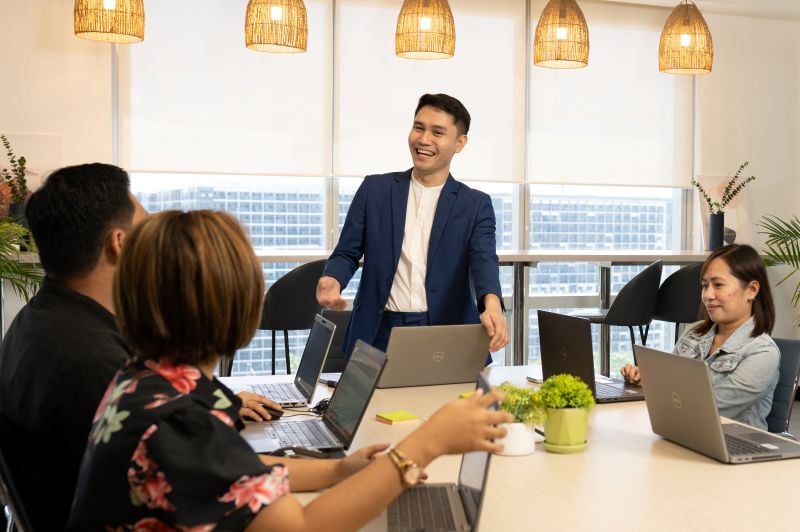 colleagues sitting around a desk