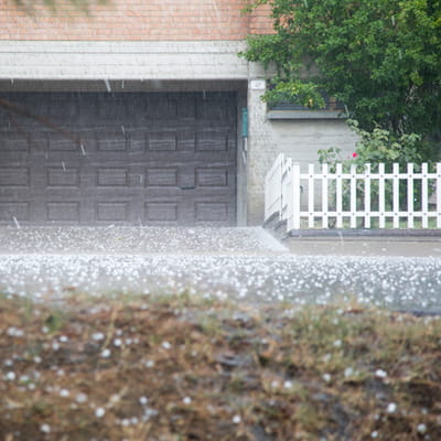 Hail stones falling in front of garage