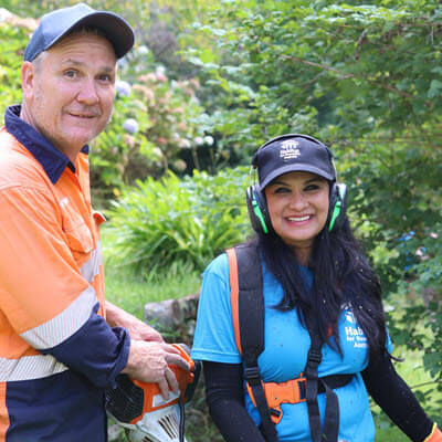 Volunteers and technical staff prepare for bushfires by clearing away potential hazards and overgrown vegetation.